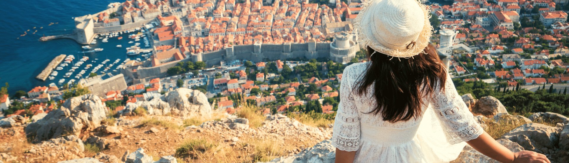 woman enjoying the view over dubrovnik with a birds eye view