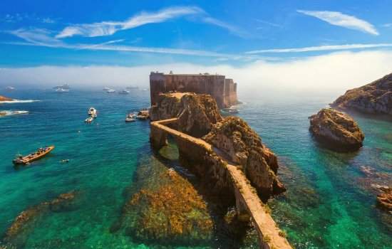 portugal castle ruins in the middle of the sea with crystal clear waters