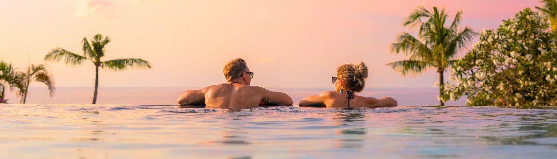 honeymoon couple enjoy sunset from their vietnam infinity pool