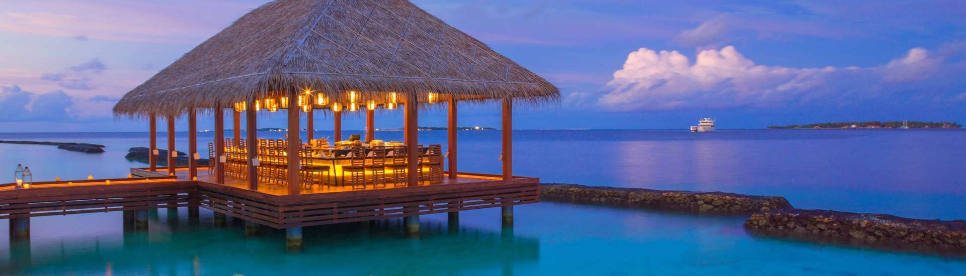 straw roof hut overlooking the stunning maldives waters